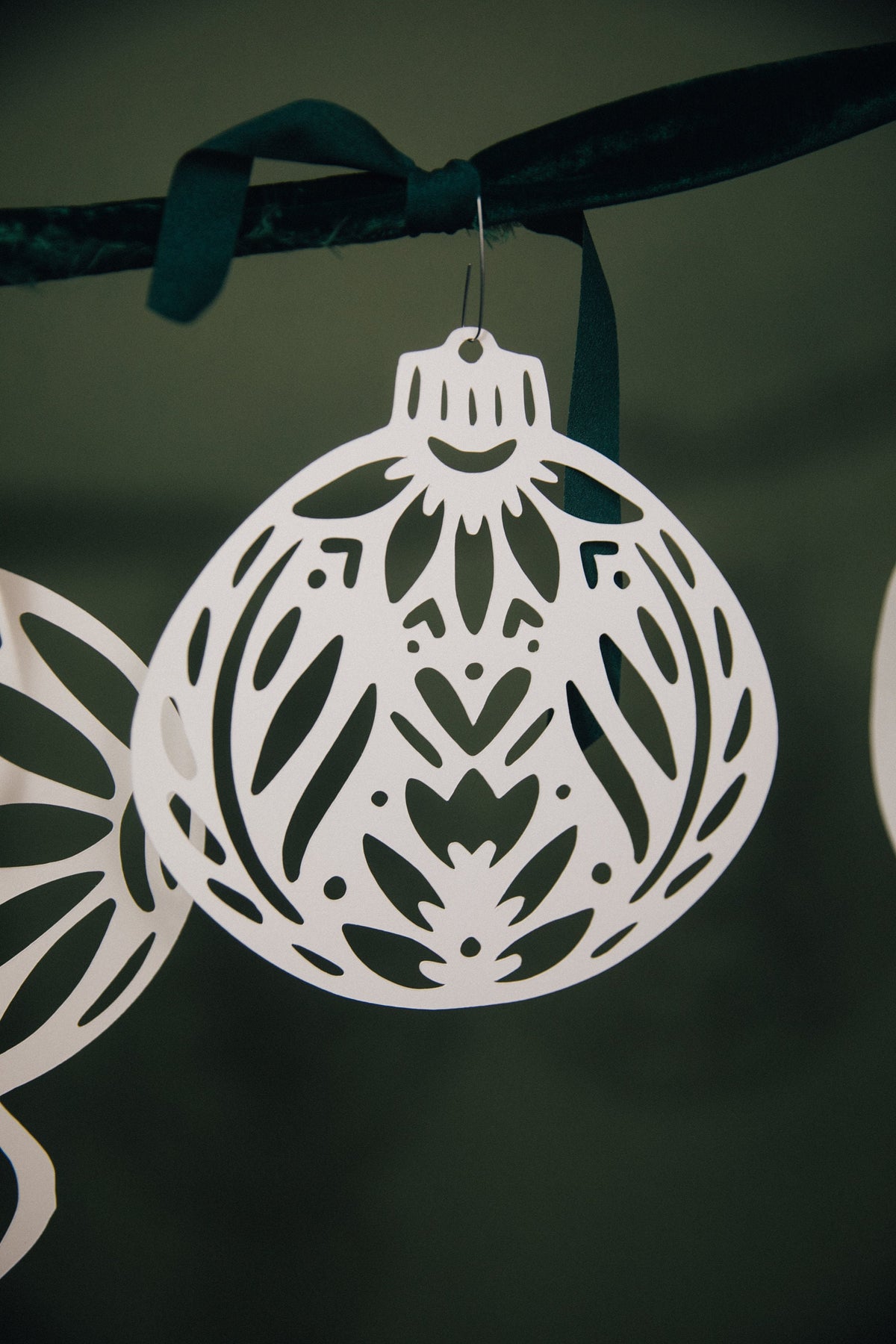 Close-up of Nordic paper ornament texture - hand-cut holiday decor by Hinterland Goods